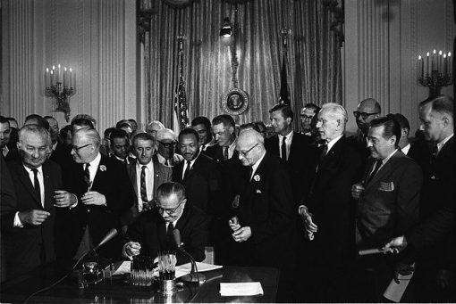 Civil Rights Act 1964 signed by Lyndon B Johnson with Dr. Martin Luther King jr. present.