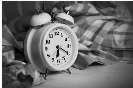 Set your alarm clock to wake up black and white photo.